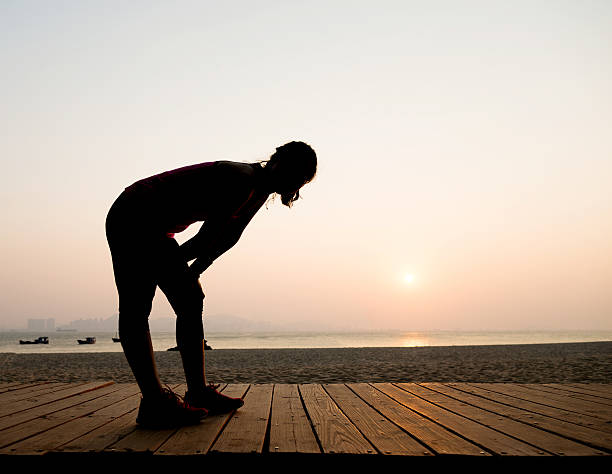 istock Silhouette of a tired runner 636878352