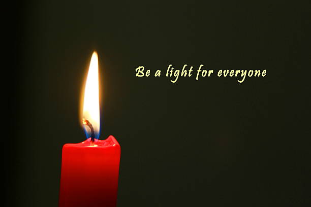 istock Red candle with dark background and english text 636879884