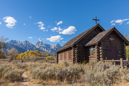 historic chapel of the transfiguration in teton national park in fall