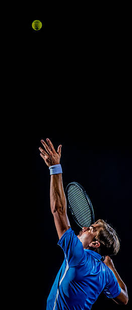istock Playing tennis at court 636883942