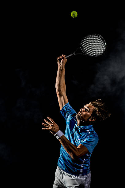 istock Playing tennis at court 636884110