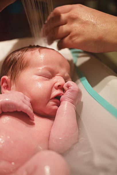 istock Baby Girl Bathtime 636884474