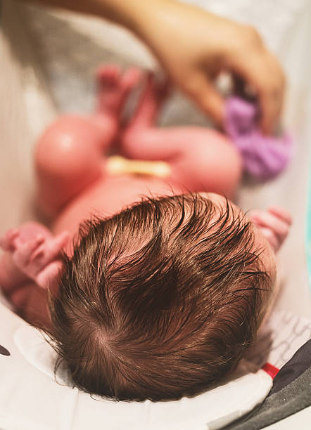 istock Baby Girl Bathtime 636884616
