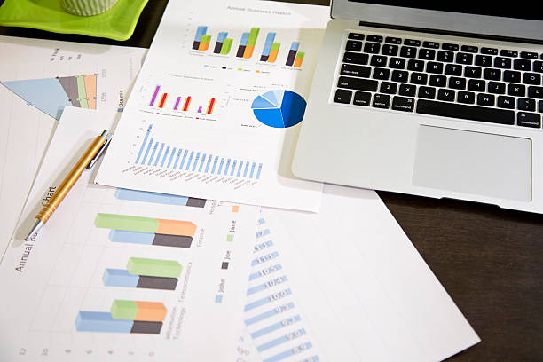 istock Annual business reports at office desk 636888382