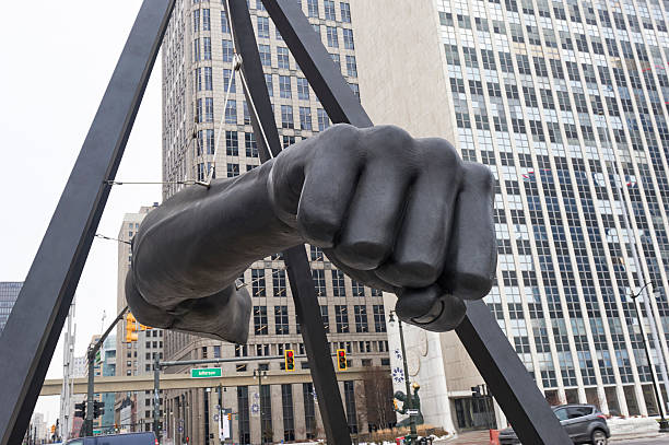The Fist Detroit, USA - December 23, 2016: "The Fist" a Monument to professional boxer Joe Louis, located in Downtown Detroit's Hart Plaza. Designed by Robert Graham, and dedicated in 1986. detroit michigan photos stock pictures, royalty-free photos & images