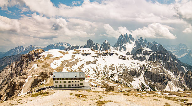istock Dolomite Alps rocky mountain range and refuge 636891122