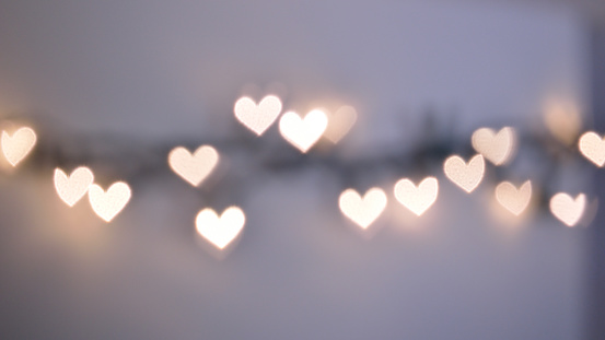 Bokeh lights, in the shape of little hearts, pastel