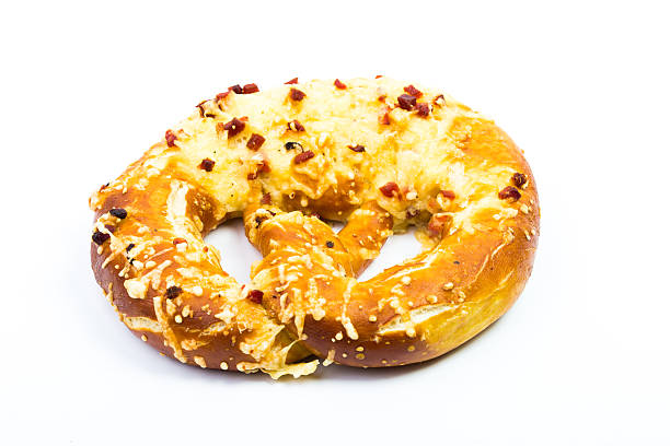 istock Hot pretzels with ham and cheese on white background 636892436
