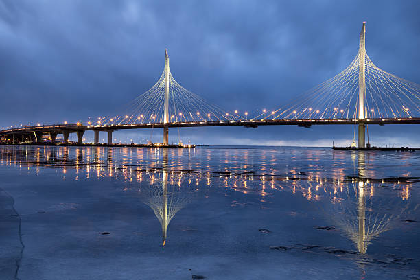 Western high-speed diameter in Saint-Petersburg. The new cable-stayed bridge across the Neva river is reflected in the ice.
