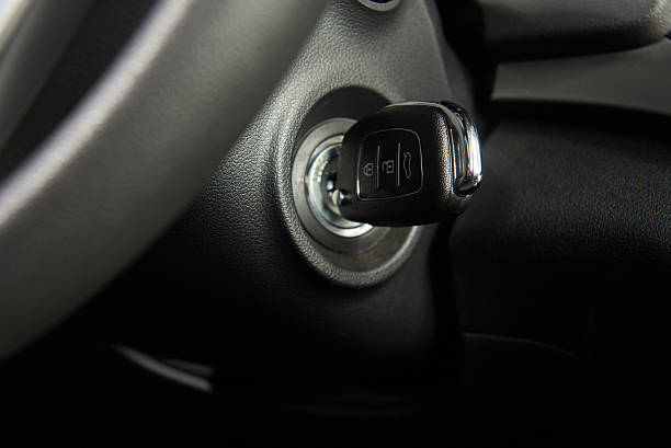 Ignition key of modern car Ignition key of modern car close up. Car key in keyhole ignition photos stock pictures, royalty-free photos & images