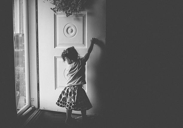 istock Toddler Girl Playing with Front Door 636897058