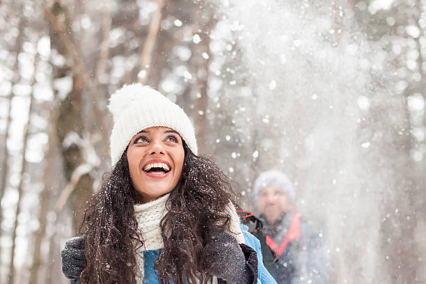 cheerful young woman having fun in the snow forest - skiing winter women snow imagens e fotografias de stock
