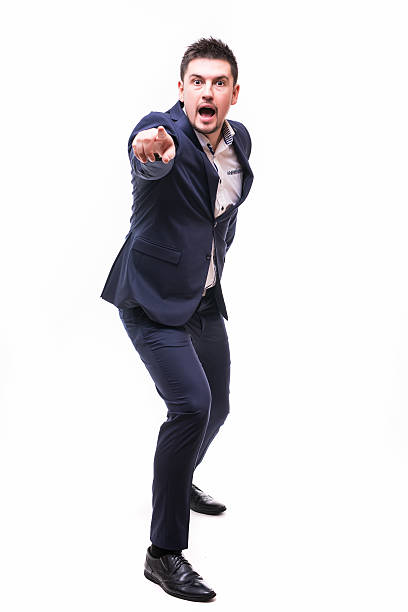 istock Happy handsome young businessman pointed with finger on you 636900292