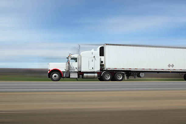 istock Semi truck on interstate, lots of motion blur 636903452