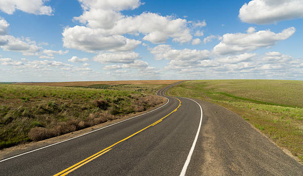 istock Long Winding Road Cury into The Distance Vanishing Point 636903570