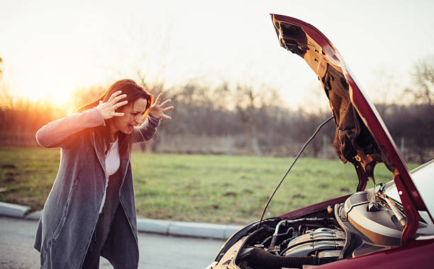 istock Woman having car trouble 636905878