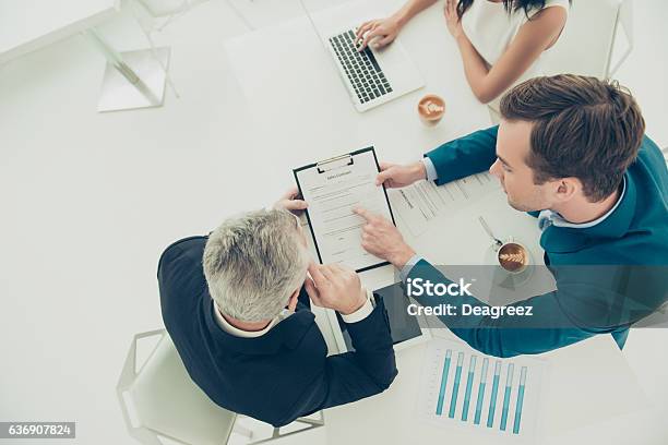Businessman Pointing On One Of The Conditions Of Contract Stock Photo - Download Image Now