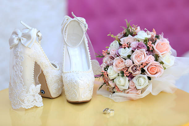 istock Wedding rings and shoes 636908628