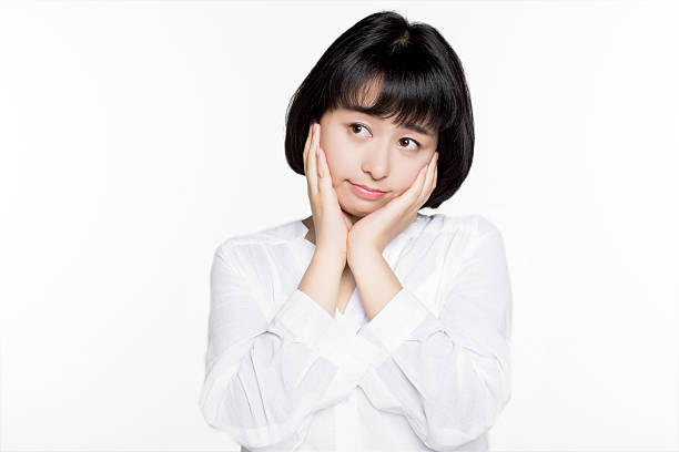 istock woman performing facial expression 636908778