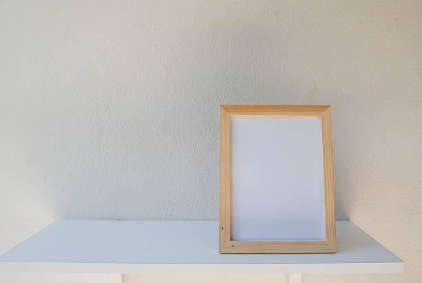 istock photo Frame on a wooden on White background 636918166