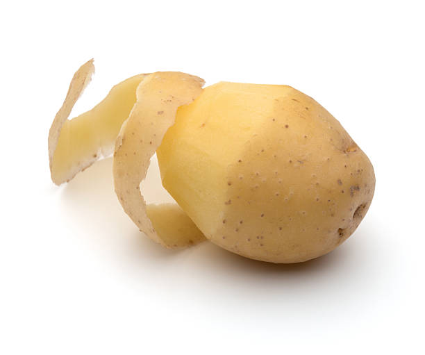 istock peeled potato tuber with peel spiral isolated 636920990