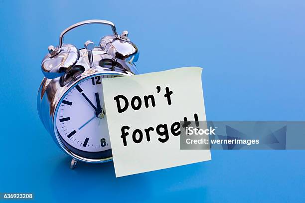 Alarm Clock With Sticker With Words Dont Forget Stock Photo - Download Image Now - Reminder, Urgency, Adhesive Note