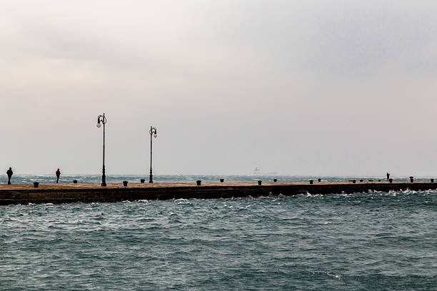 istock windy afternoon on the pier 636923210