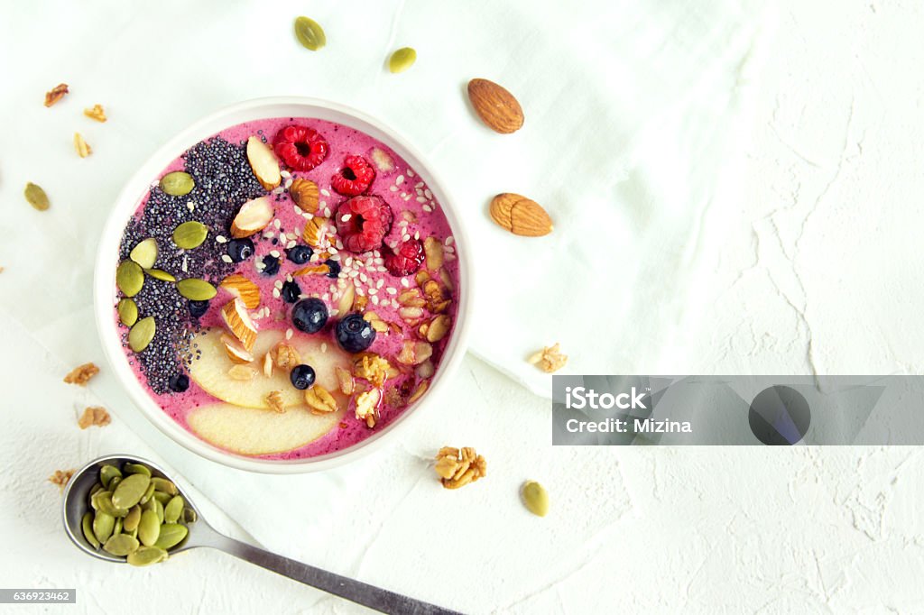 Smoothie bowl Smoothie bowl with fresh berries, nuts, seeds and homemade granola for healthy breakfast, copy space Bowl Stock Photo