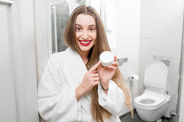 istock Woman with cosmetic in the bathroom 636929952