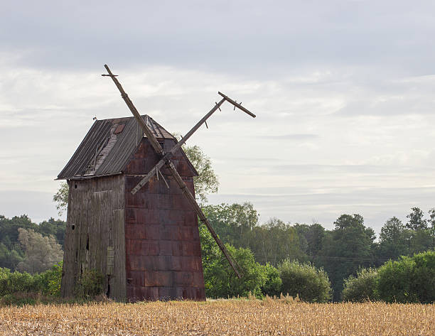 istock Kawnice, Poland. Old ruined windmill on the field. 636935186