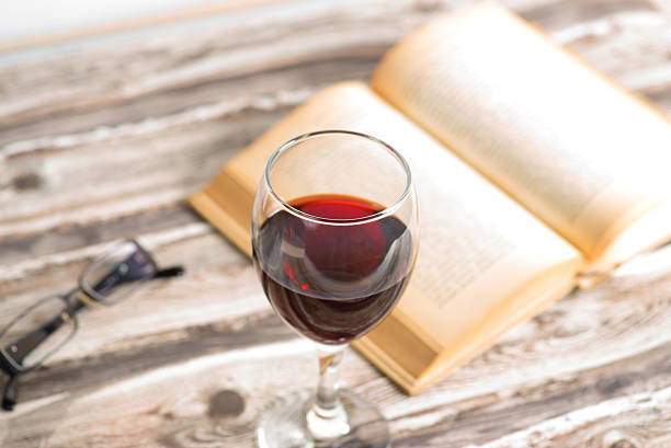 istock A book and glass of red wine 636938050