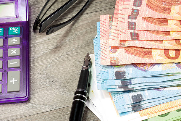 istock Cash and a calculator 636939426