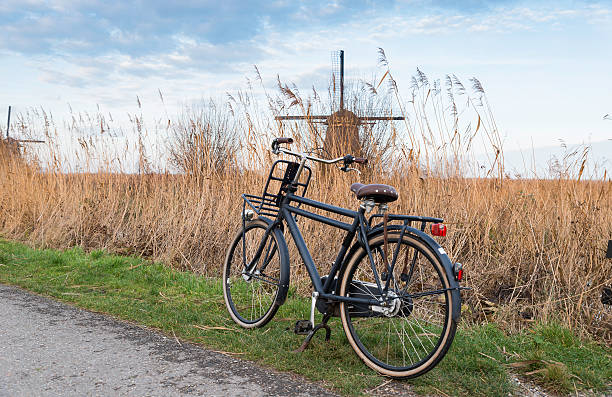 istock old type of bike and windmill 636941164