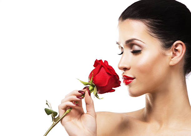 istock romantic woman holding red rose on white background 636944958