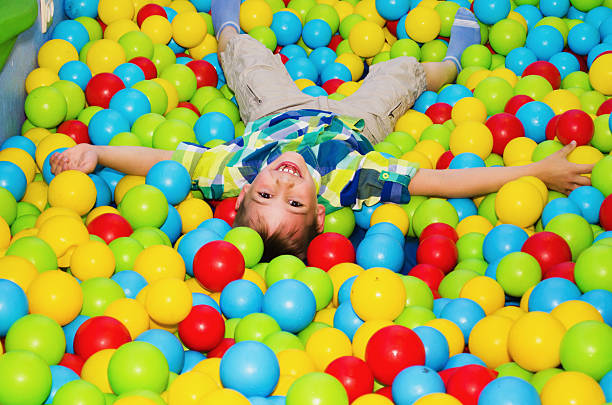 istock happy boy playing in the dry pool 636945206