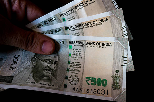 Person Holding Out The New Indian Rs 500 Note Stock Photo - Download Image  Now - Currency, Black Color, India - iStock