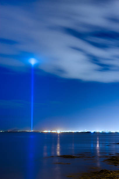 Reykjavik, Iceland - October 8, 2008: The Imagine Peace Tower is a memorial to John Lennon from his widow, Yoko Ono, located on Videy Island, off the coast of Reykjavik, Iceland. It consists of a tall \