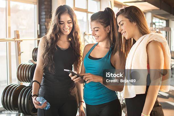 Using App With Friends Group Friends Using App On Smartphone While Resting After Practice ...