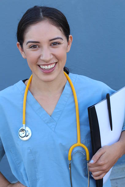 istock Brunette spanish doctor woman with a clipboard 636949012