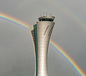 Airport Control Tower with a Rainbow in the Background