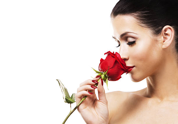 istock romantic woman holding red rose on white background 636951024