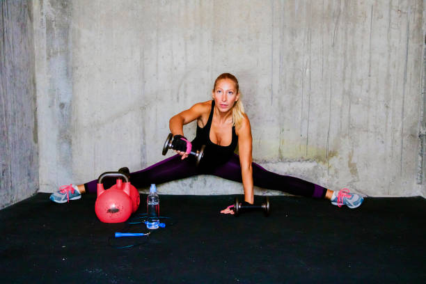 istock Gym woman with dumbbells 636951588