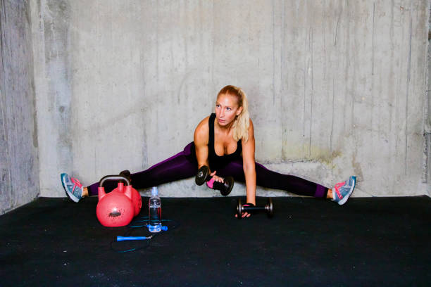 istock Gym woman with dumbbells 636951620