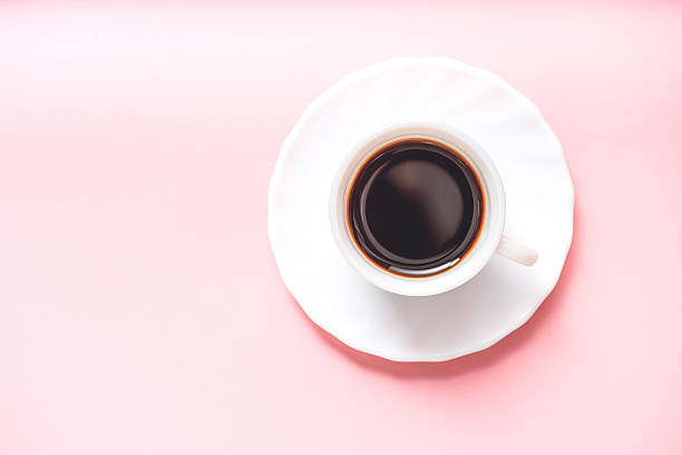 istock Bracing dark beverage at pink area 636956190