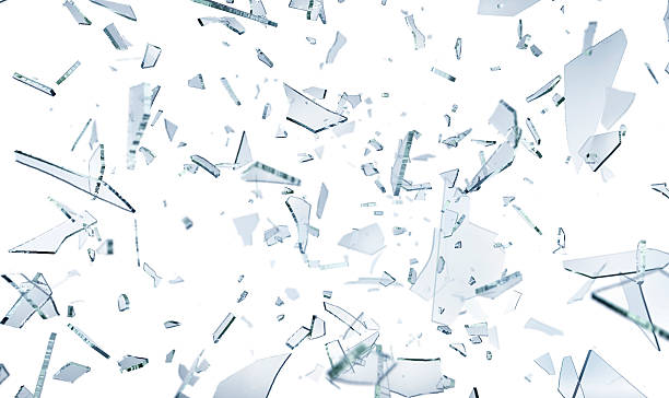 Shattering glass pieces on white