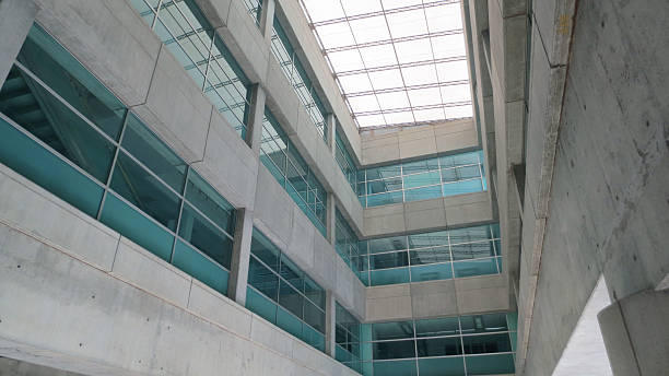 istock Glass wall in modern office building 636957772