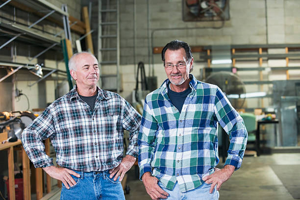 istock Two men working in factory warehouse 636961646