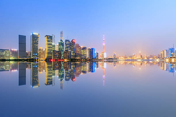 istock Shanghai skyline on the Huangpu River at night 636963696
