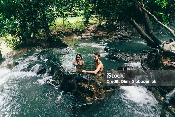 Couple Bathing In Hot Spring Waterfall Stock Photo - Download Image Now - Hot Spring, Two Parents, Krabi Town