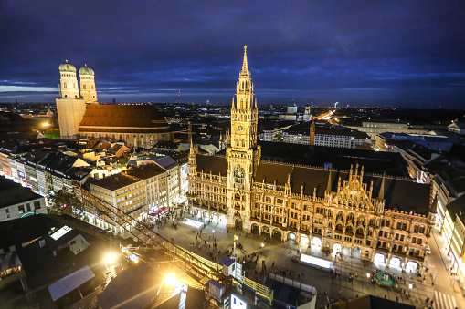 High angle view of Marienplatz, The New Town Hall (Neues Rathaus) and Frauenkirche at night in Munich, Germany.